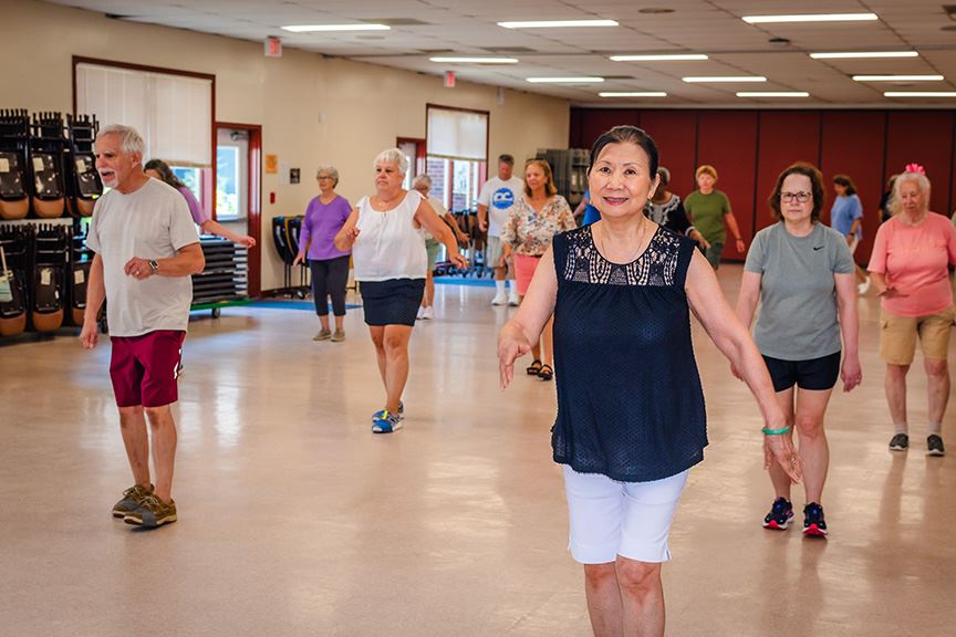 Aging people linedancing