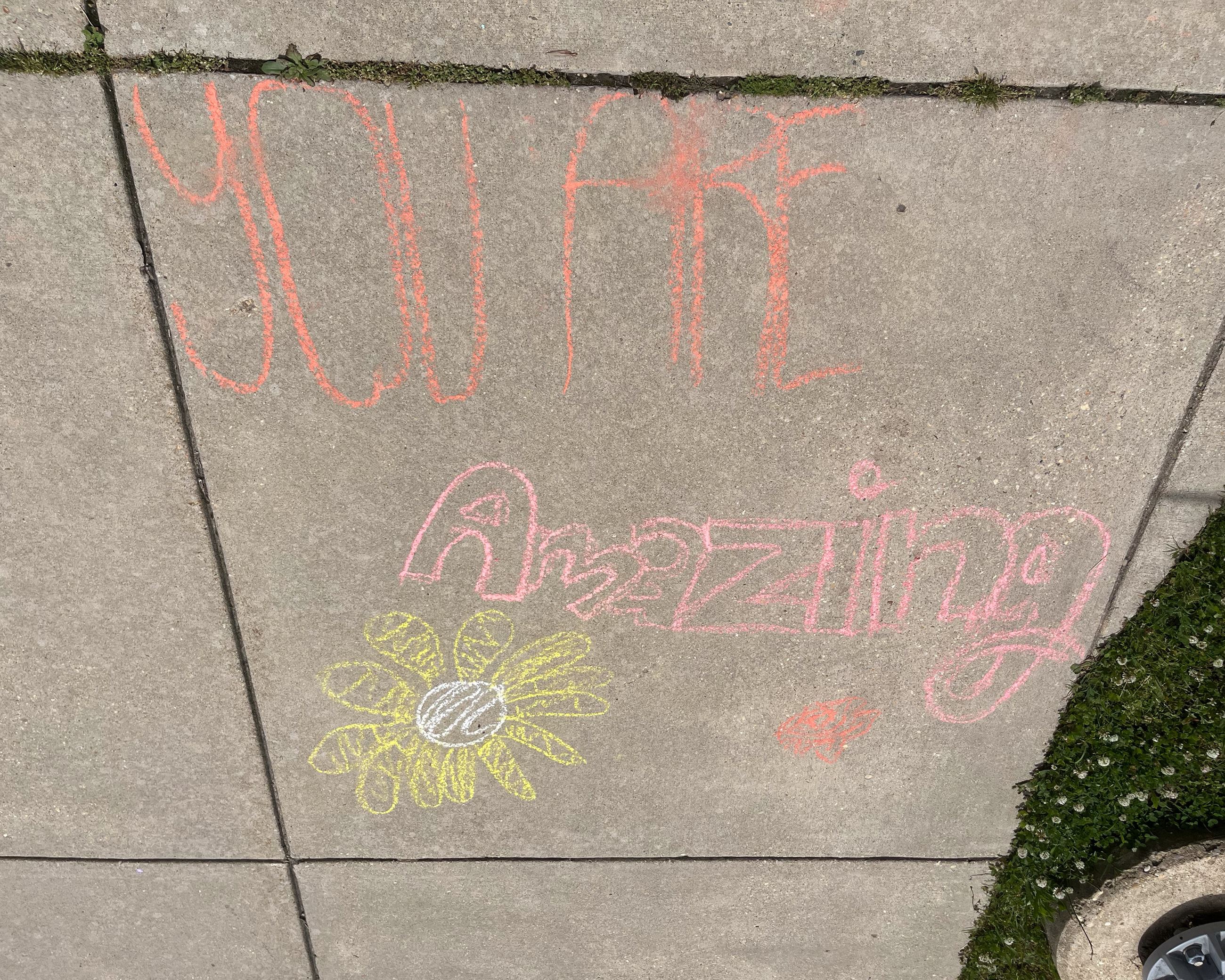 A student writes in orange chalk "Have a good day. CHS 2026."